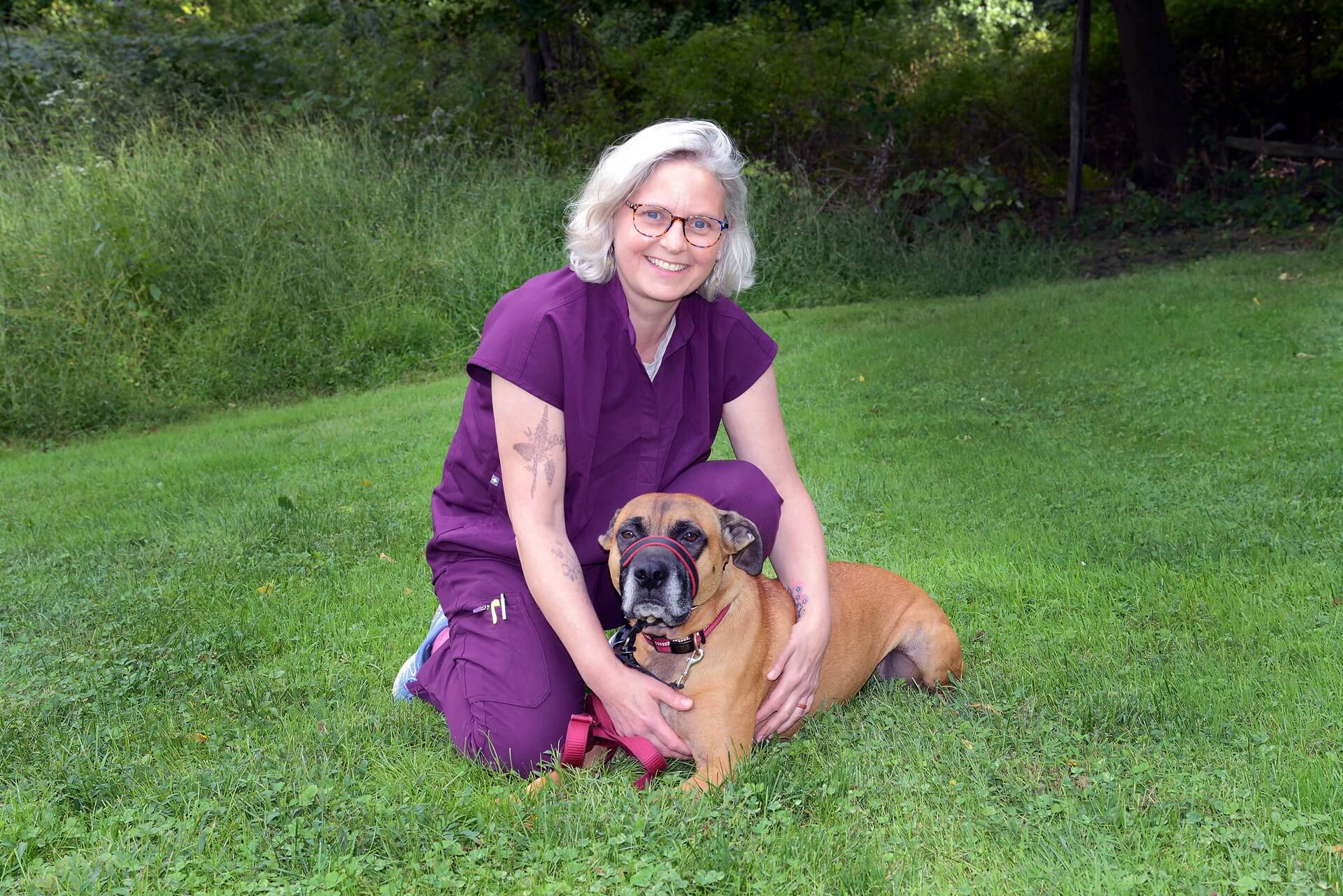 Female vet holding a dog